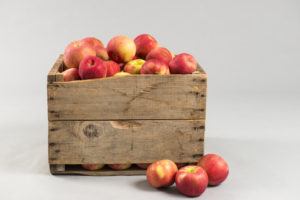 Wooden crate full of apples with space for text